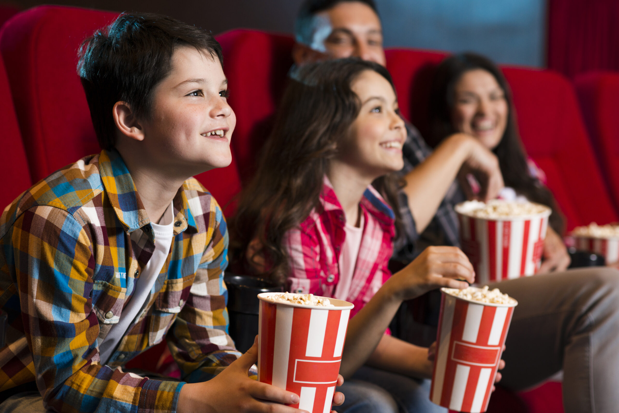 happy-family-sitting-cinema